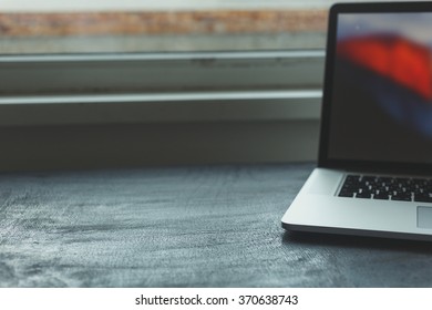 Workplace With Open Laptop On Black Modern Wooden Desk, Angled Notebook On Table In Home Interior, Filtered Image, Soft Focus