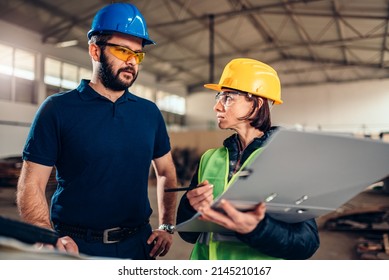 Workplace Safety Inspector Writing A Report At Industrial Factory