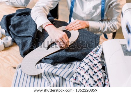 Similar – Image, Stock Photo Dressmaker cutting a cloth