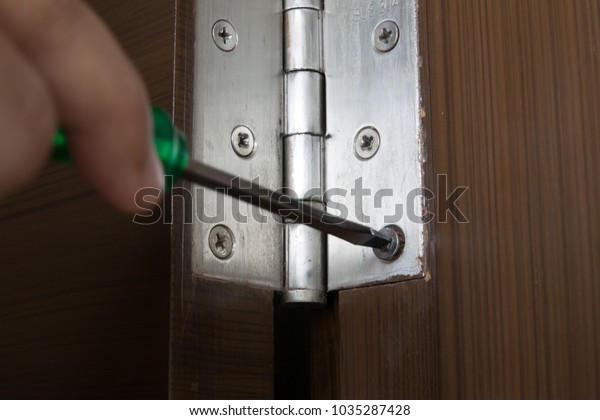 Works Hand Uses Green Screwdriver Install Stock Photo Edit