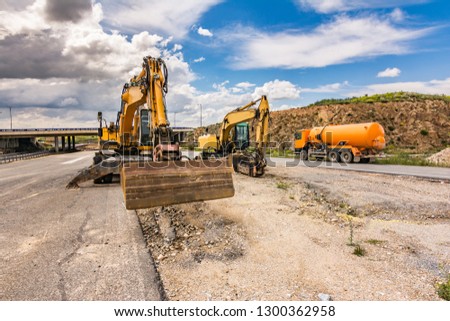 Works of repair and expansion of a road with different heavy machinery