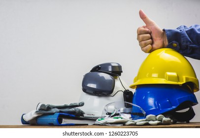 Works Safety Concept: PPE (Personal Protective Equipment), Hard Hat Or Industrial Helmet For Protection The Worker From Accident During Working At Construction Site, Factory Or Industry Building.