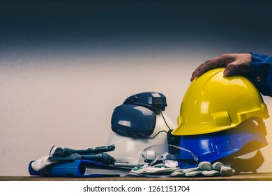 Works Safety Concept: PPE (Personal Protective Equipment), Hard Hat Or Industrial Helmet For Protection The Worker From Accident During Working At Construction Site, Factory Or Industry Building.