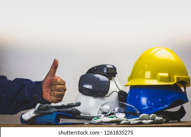 Works Safety Concept: PPE (Personal Protective Equipment), Hard Hat Or Industrial Helmet For Protection The Worker From Accident During Working At Construction Site, Factory Or Industry Building.