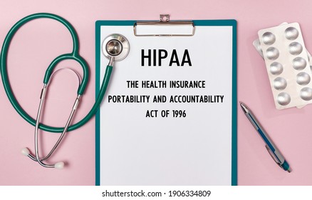 Worksheet with the inscription HIPAA The Health Insurance Portability and Accountability Act of 1996, stethoscope and pills, top view