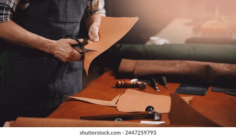 Workshop background tailor shoes maker from skin.Banner shoemaker industry business, Natural leather brown color with tools.