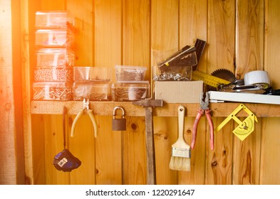 Workshop with a lot of old tools. brush, hammer, nails. Organized tools
