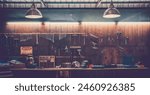 Workshop scene. Old tools hanging on wall in workshop, Tool shelf against a table and wall, vintage garage style