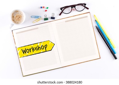 Workshop text on notebook with copy space