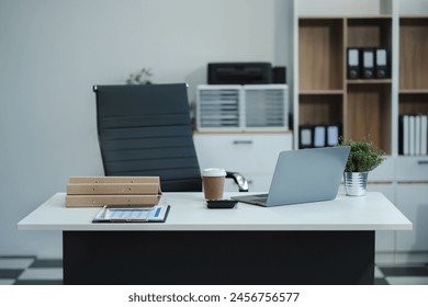 workspace area with laptop tablet smartphone and paperwork on the table in the office concept.