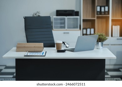 workspace area with laptop tablet smartphone and paperwork on the table in the office concept.