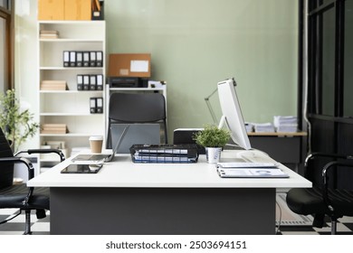 workspace area with laptop tablet smartphone and paperwork on the table in the office concept.