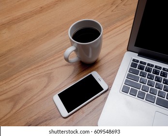 Workspace with coffee phone and computer