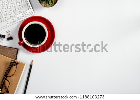Workspace with computer, colour pencils and coffee mug on white background. Flat lay, top view