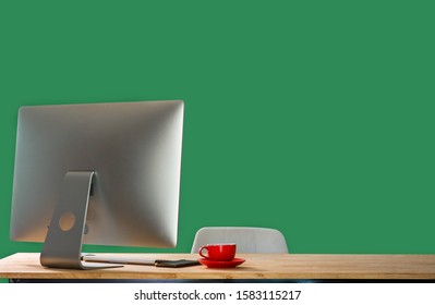 Workspace With Computer, Keyboard,coffee Cup And Mouse With Blank Or White Screen Isolated Is On The Work Table At The Mountain And Sea Green Background.