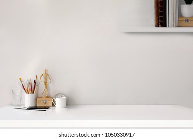 Workspace concept : creative work place desk. - Shutterstock ID 1050330917