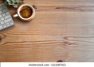 Workspace and copy space. computer and coffee on wooden table.