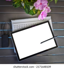 Workspace digital tablet on the table with blank white screen on table, top view