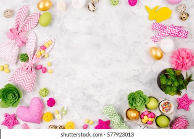 Workspace With Easter Decoration. Painted Eggs In Trays, Candy, Flowers, Succulent With Copy Space. Holiday Background. Flat Lay, Top View