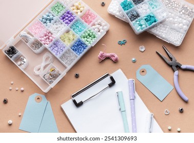 A workspace is filled with colorful beads, handmade tags, and crafting tools. Brightly colored supplies are spread out, inviting creativity and exploration in jewelry making. - Powered by Shutterstock