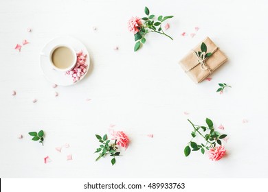 Workspace. Gift, Cup Of Coffee And Rose Flowers. Flat Lay, Top View, Copy Space