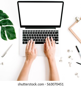 Workspace With Hands Typing On Laptop With Blank Screen. Flat Lay, Top View