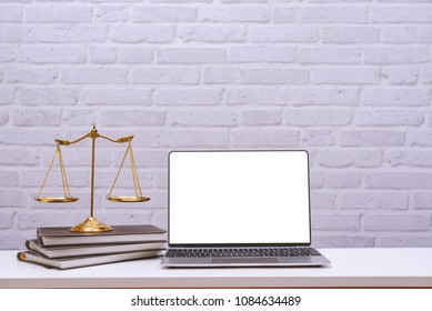 Workspace For Lawyer With Laptop Blank Screen And Wooden Gavel , Legal Law On Wood Table In Office. Workspace Background And Desk Work Mockup Concept.