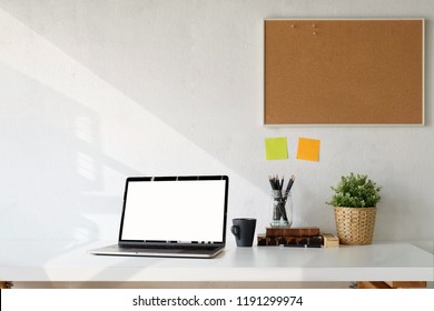 Workspace Mockup Blank Screen Laptop, Cork Board And Supplies.