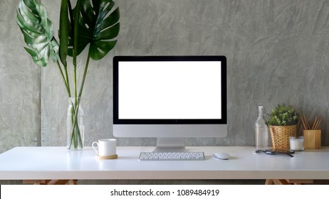 Workspace mockup desktop computer and stuff on white wooden table. - Shutterstock ID 1089484919