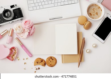 workspace with notebook keyboard, photo camera, open notebook, sketchbook and coffee on white background. Flat lay, top view office table desk.   - Powered by Shutterstock