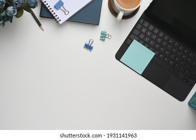 Workspace Topview Computer Keyboard And Coffee With Notebook Paper On White Desk.	