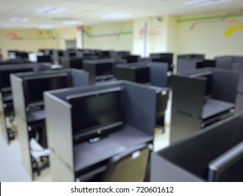 Workstation Desk For Testing In Computer Room Of University. Blur Image Use For Background.