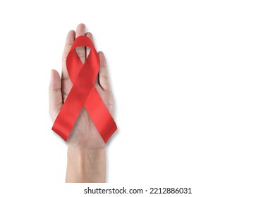 World Aids Day And National HIV AIDS And Ageing Awareness Month With Red Ribbon On Helping Hand (isolated With Clipping Path On White Background)