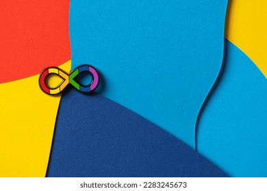 World Autism Awareness Day, Autism Acceptance Month concept.Autism infinity rainbow symbol sign on colorful background. Autism rights movement, neurodiversity, autistic acceptance movement symbol sign