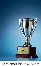 World Best Dad Trophy Against Blue Background        