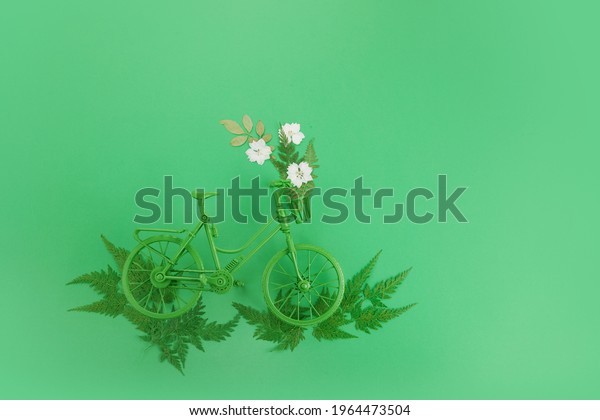 World bicycle day concept. Green bicykle on green\
background. 3 june.