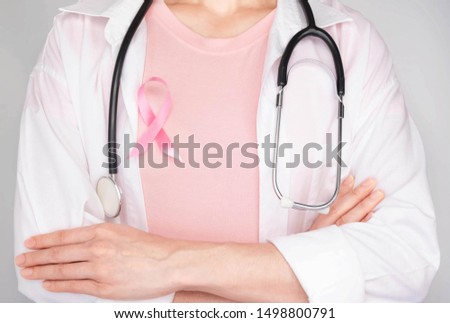World Breast Cancer Day Concept,health care - dortor and Stethoscope ,Pink ribbon for breast cancer awareness, symbolic bow color raising awareness on people living with women's breast tumor illness
