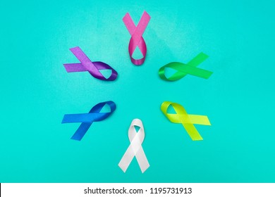 World Cancer Day Background. Colorful Ribbons, Cancer Awareness. Blue Surface From Above.