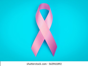 World Cancer Day : Breast Cancer Awareness Ribbon On Blue Background