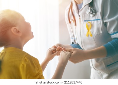 World Childhood cancer Day. Girl patient listening to a doctor in medical office.  - Powered by Shutterstock