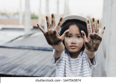 World Day Against Child Labour Concept. Dirty Hands Of Children From Construction Work.