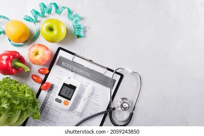 World Diabetes Day And Healthcare Concept. Diabetic Measurement Set, Patient's Blood Sugar Control And Healthy Food Eating Nutrition In Plate On Stone Background.