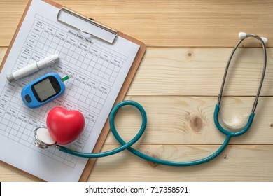 World Diabetes Day, National American Diabetic Awareness Month Concept With Blood Drop Examination Tool Kit, Blood Sugar Tracker Record And Heart With Doctor's Stethoscope