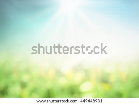 World environment day concept: Blur green garden nature and blue sky on agriculture field background
