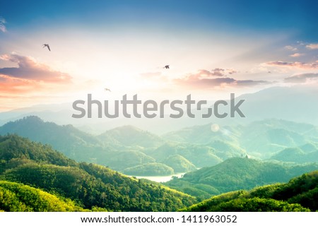 World Environment Day concept: Green mountains and beautiful sky clouds under the blue sky