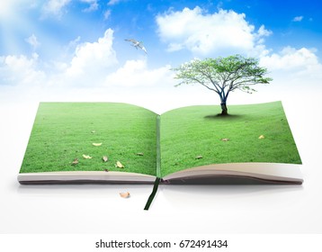 World environment day concept: Opening book of nature with bird flying over blue sky background - Shutterstock ID 672491434
