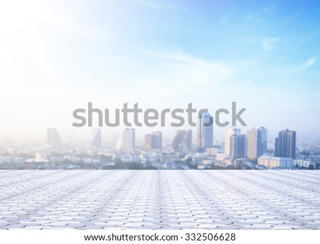World environment day concept: Stone terrace at rooftop with abstract blur city and blue sky and clouds background. Bangkok, Thailand, Asia