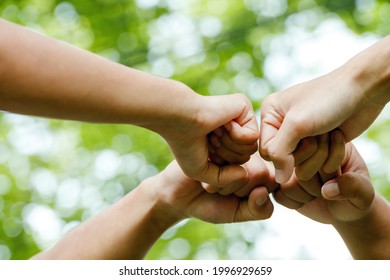 World environment day with global community teamwork,Group of volunteer join hand together concept, Volunteer charity work. People joining for cooperation success.sustainable development goal  - Shutterstock ID 1996929659