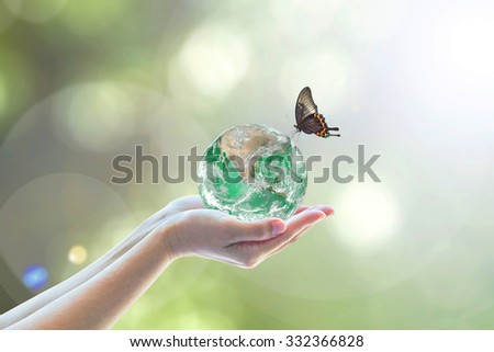 World environment protection, earth day, go green concept with green globe, butterfly, and human for harmony ecosystems of natural living life conceptual idea: Elements of this image furnished by NASA