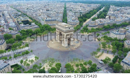World famous Arc de Triomphe at the city center of Paris, France. Sky view